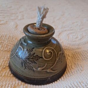 Handmade pottery lamp with wick